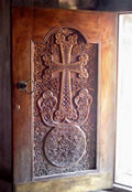 Khachkar-styled wooden door of the gavit, Gandzasar.